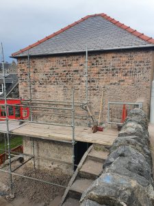 A bare station, with the old harling removed