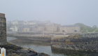 A sea haar gives an atmospheric view of the Old Harbour