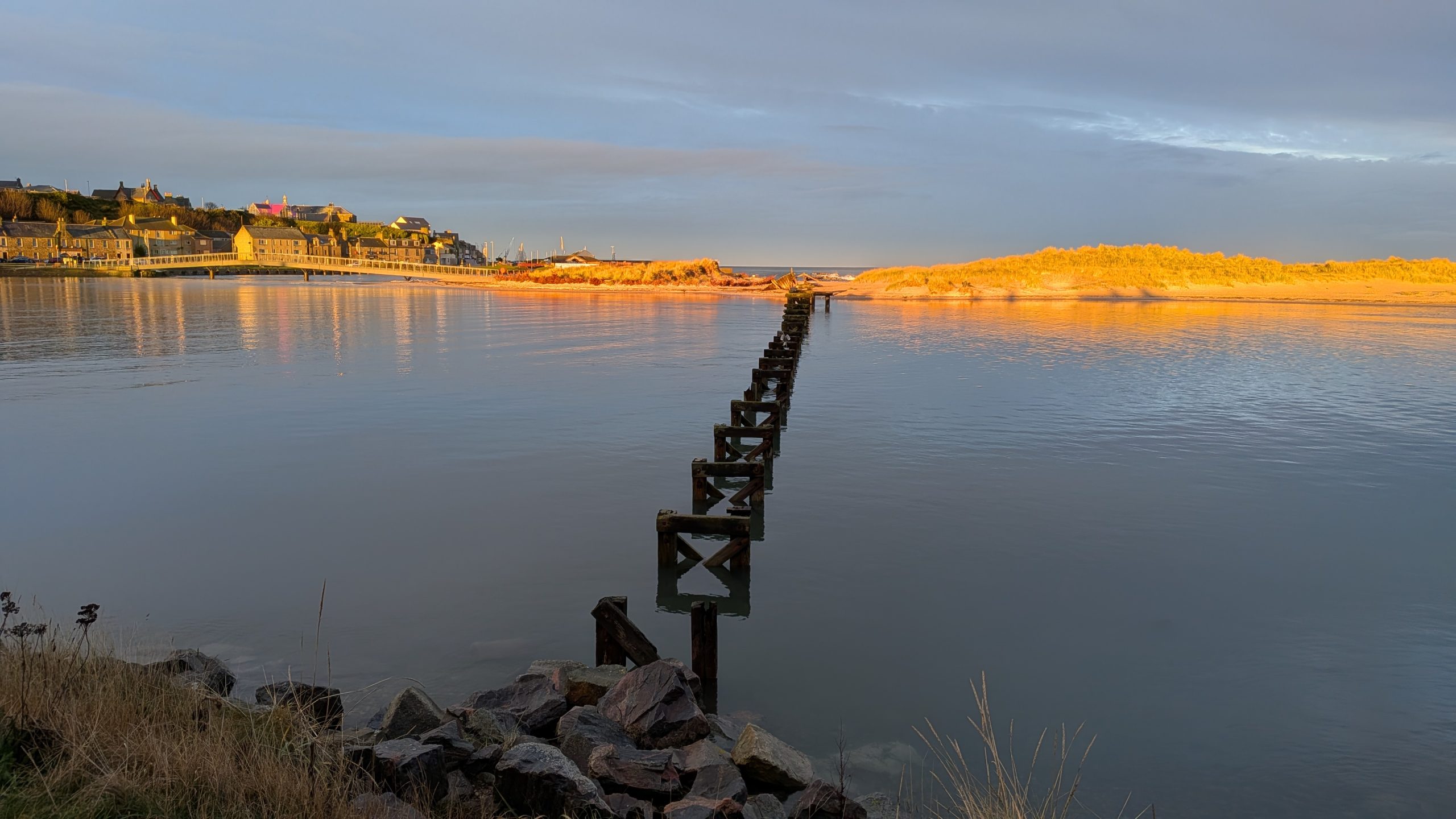 old bridge at high tide on a still day